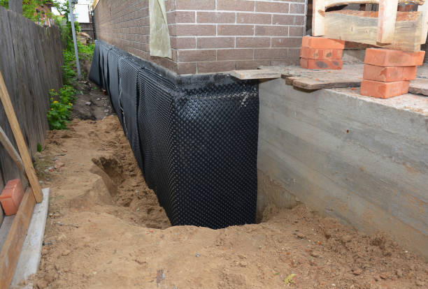 Happy homeowners after waterproofing job in Lakeville
